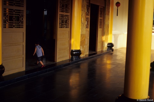 Boy Walking Into Temple